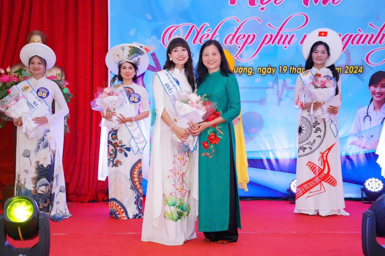 A group of women posing for a photo  Description automatically generated