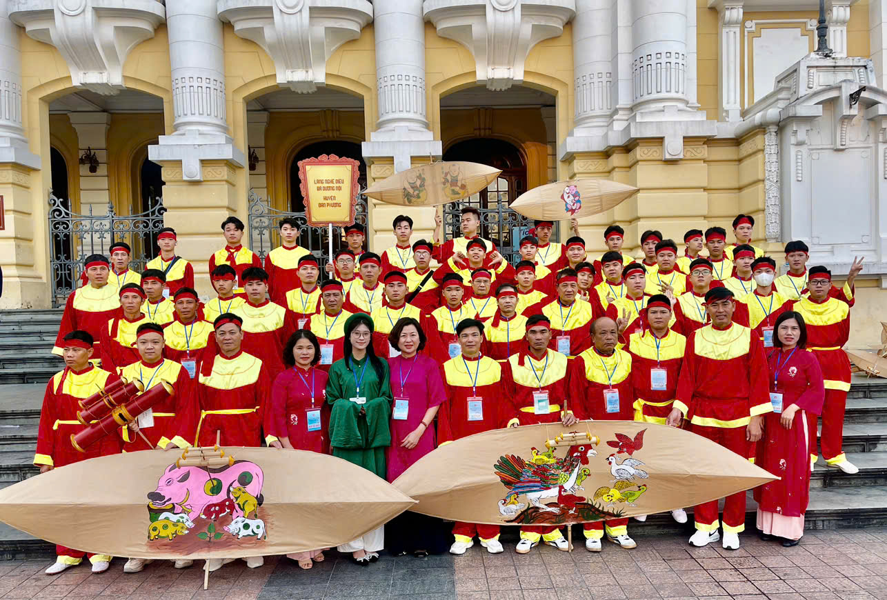 A group of people in red and yellow outfits  Description automatically generated