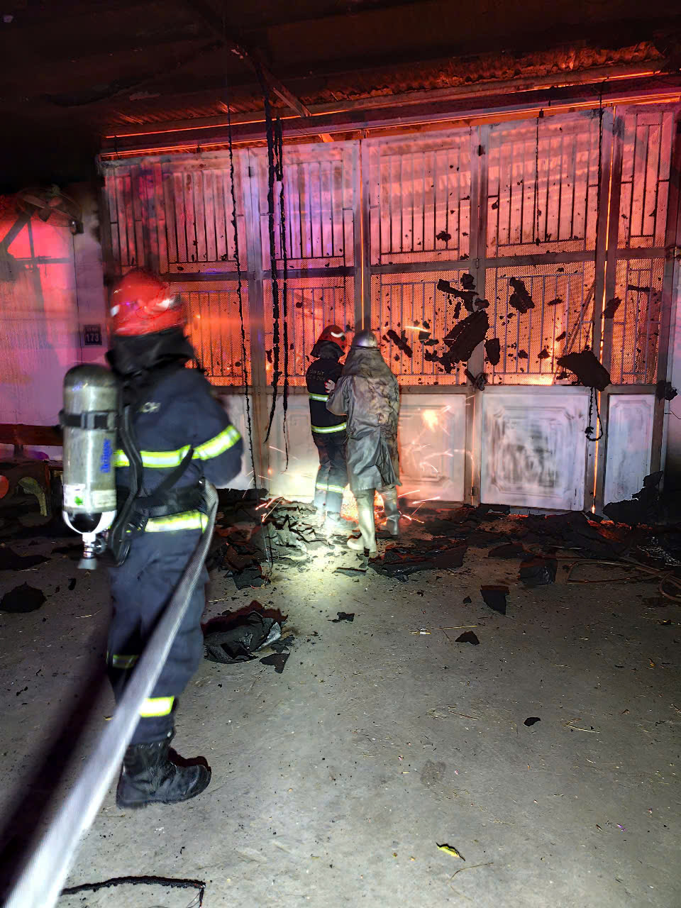 A firemen in a building  Description automatically generated with medium confidence