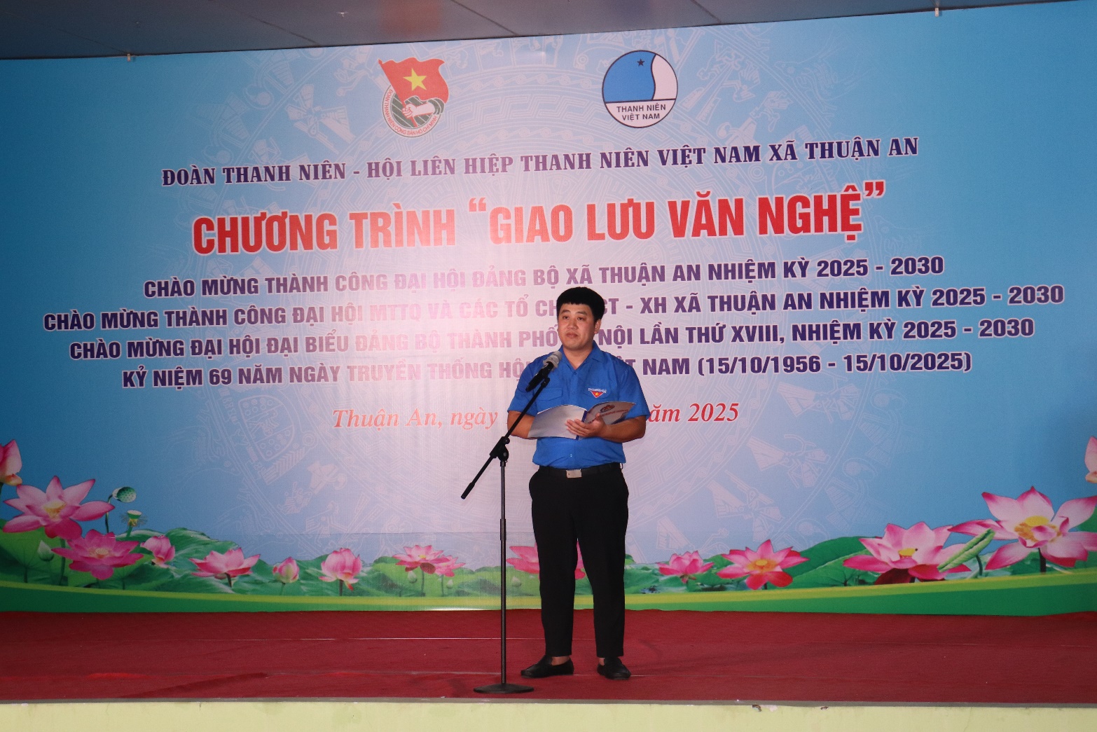 A person standing in front of a banner  AI-generated content may be incorrect.