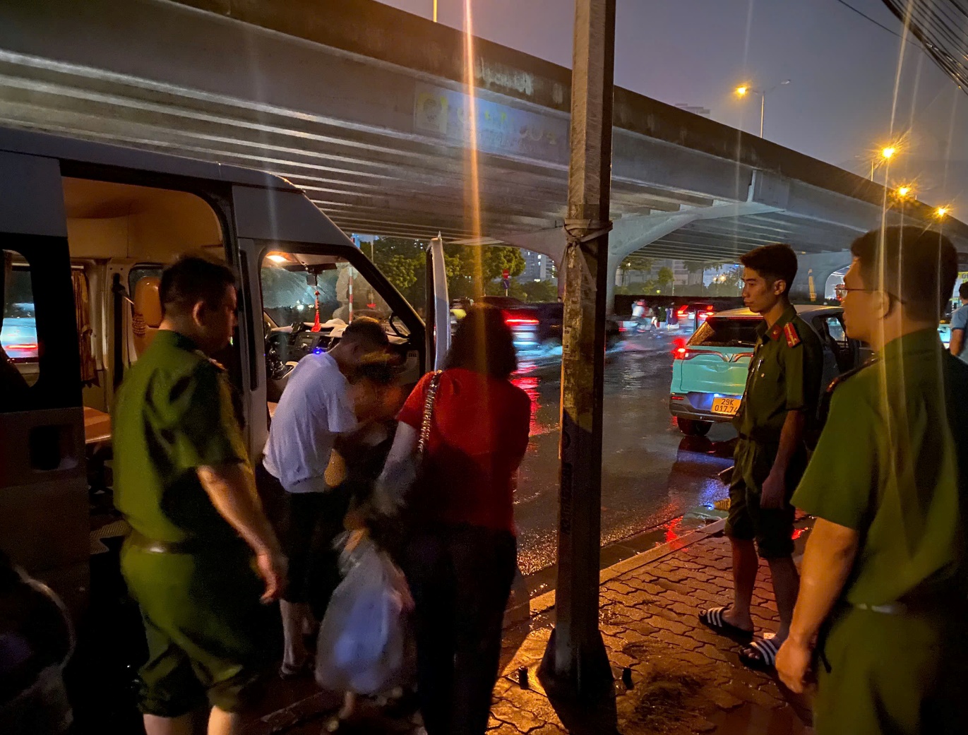 A group of people standing outside of a bus  AI-generated content may be incorrect.