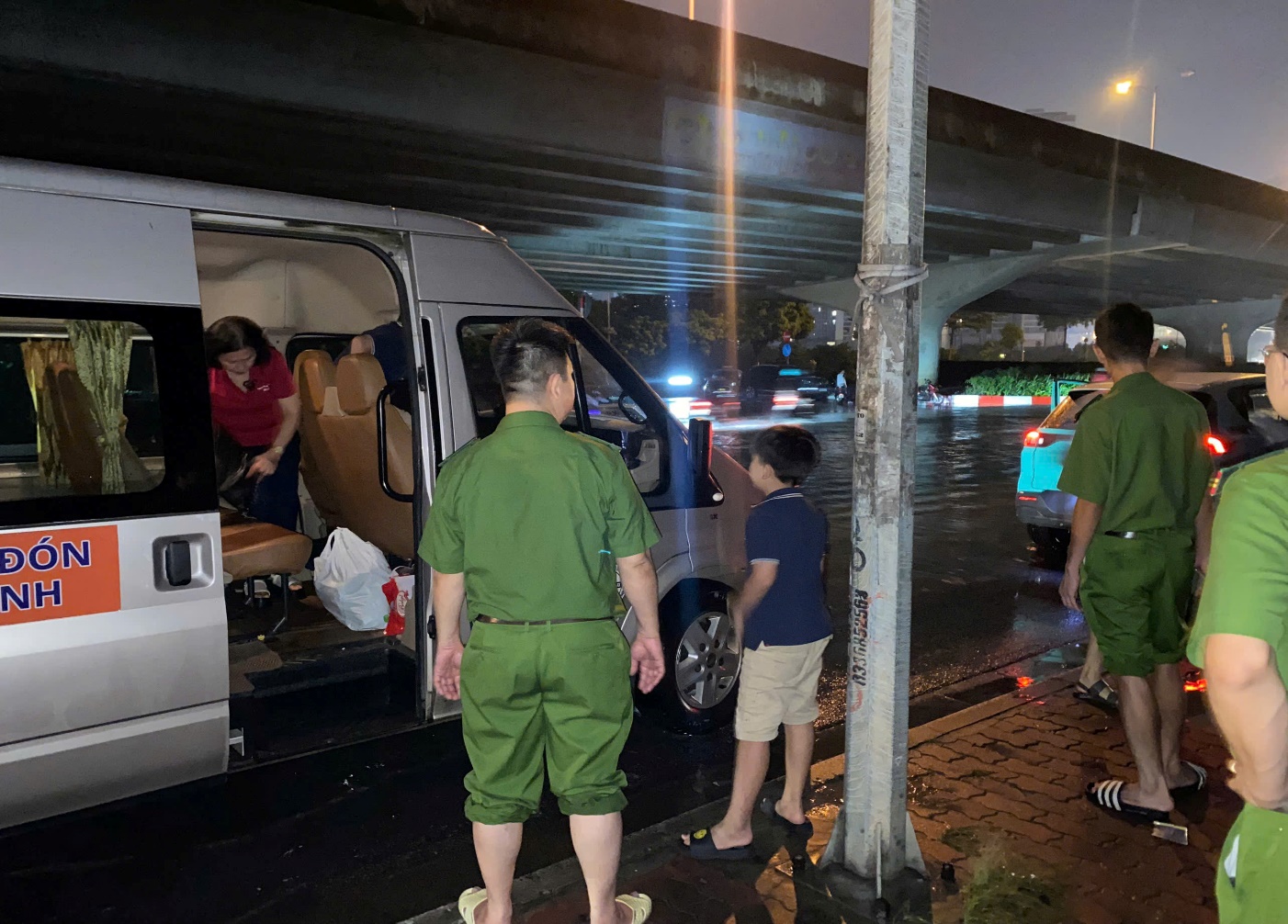 People standing next to a van  AI-generated content may be incorrect.