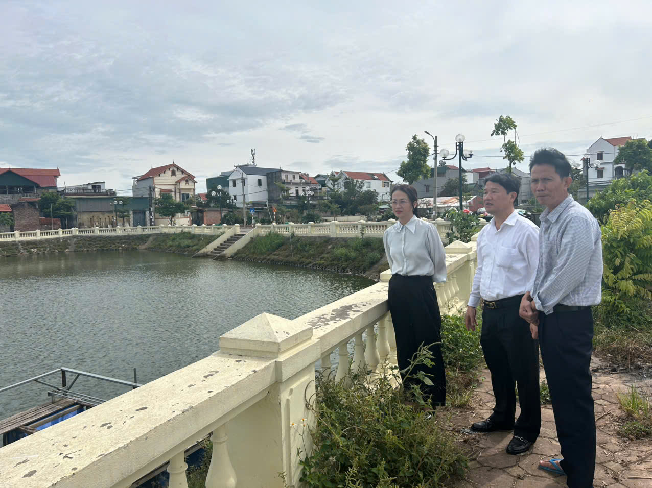 A group of men standing on a bridge by a body of water  AI-generated content may be incorrect.