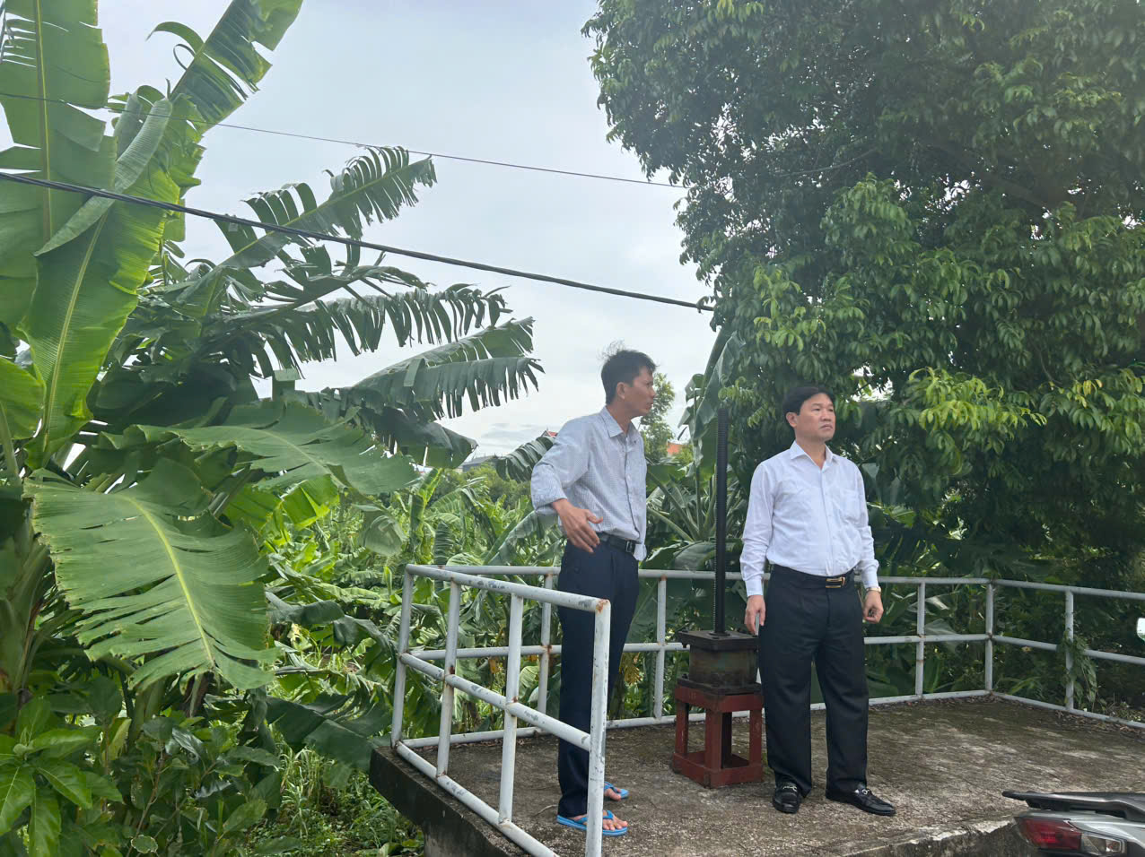 Two men standing on a bridge  AI-generated content may be incorrect.