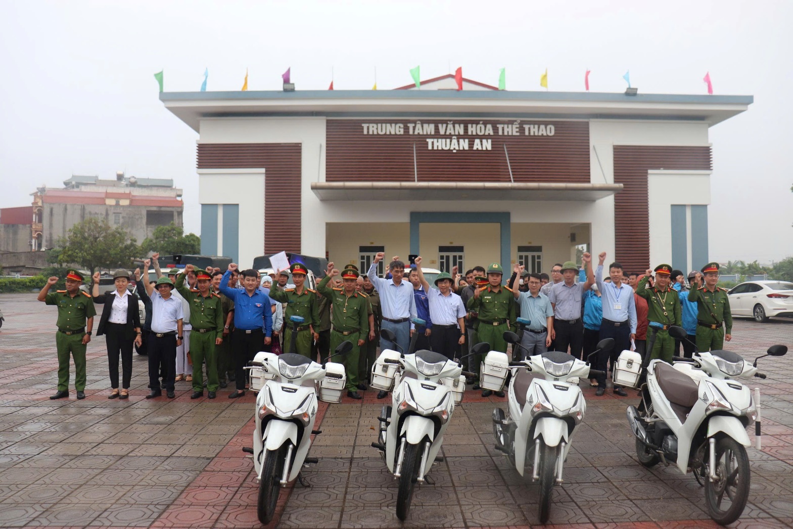 A group of people standing in front of a building  AI-generated content may be incorrect.