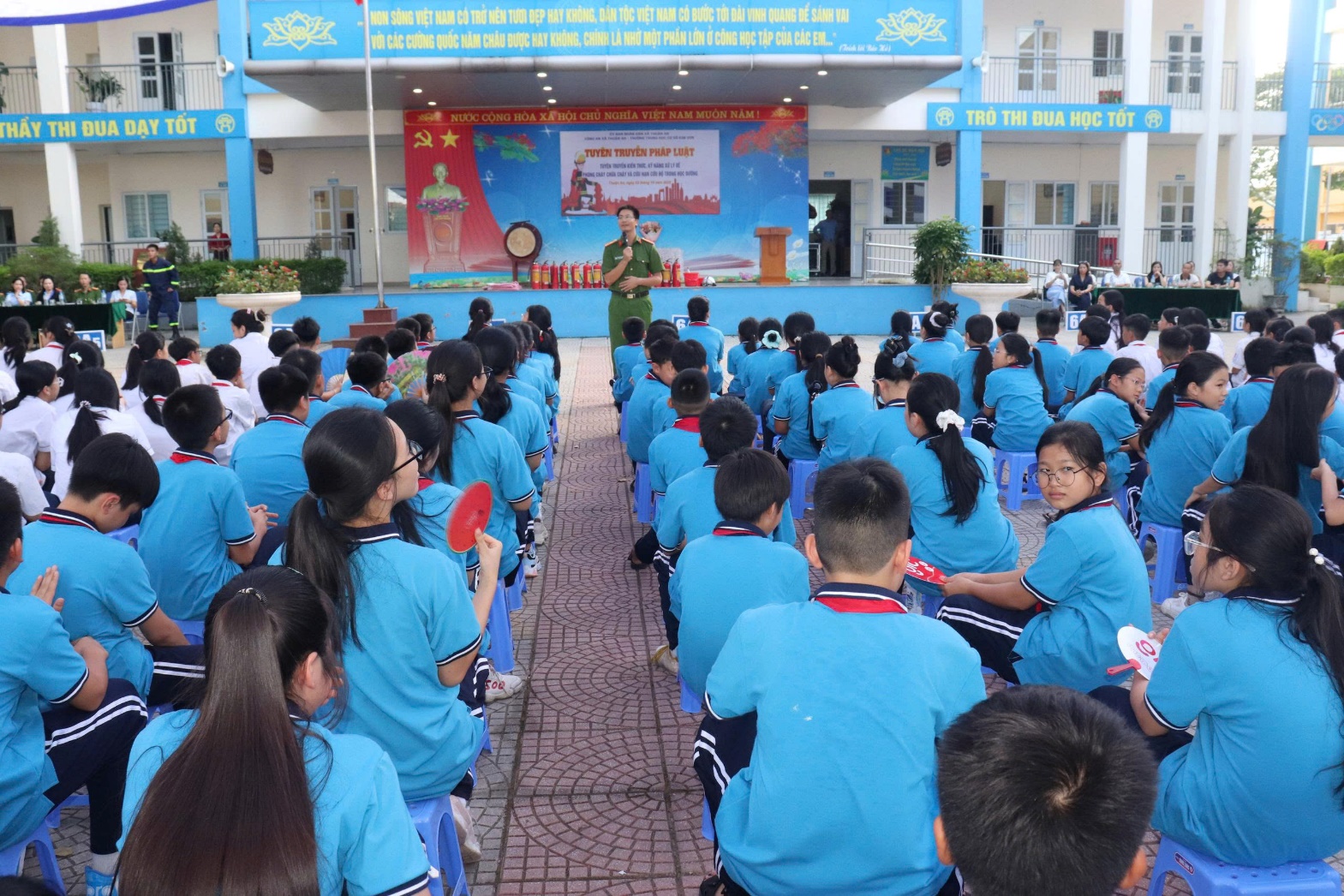 A group of children in blue uniforms  AI-generated content may be incorrect.