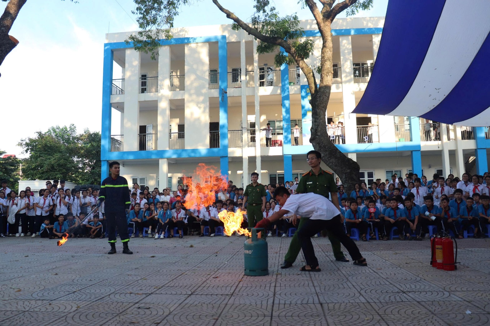 A group of people in uniform performing a fire show  AI-generated content may be incorrect.