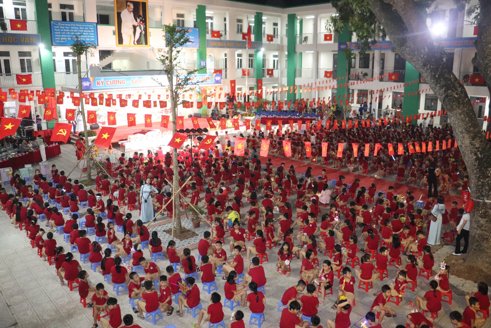 A large group of people in red shirts  AI-generated content may be incorrect.