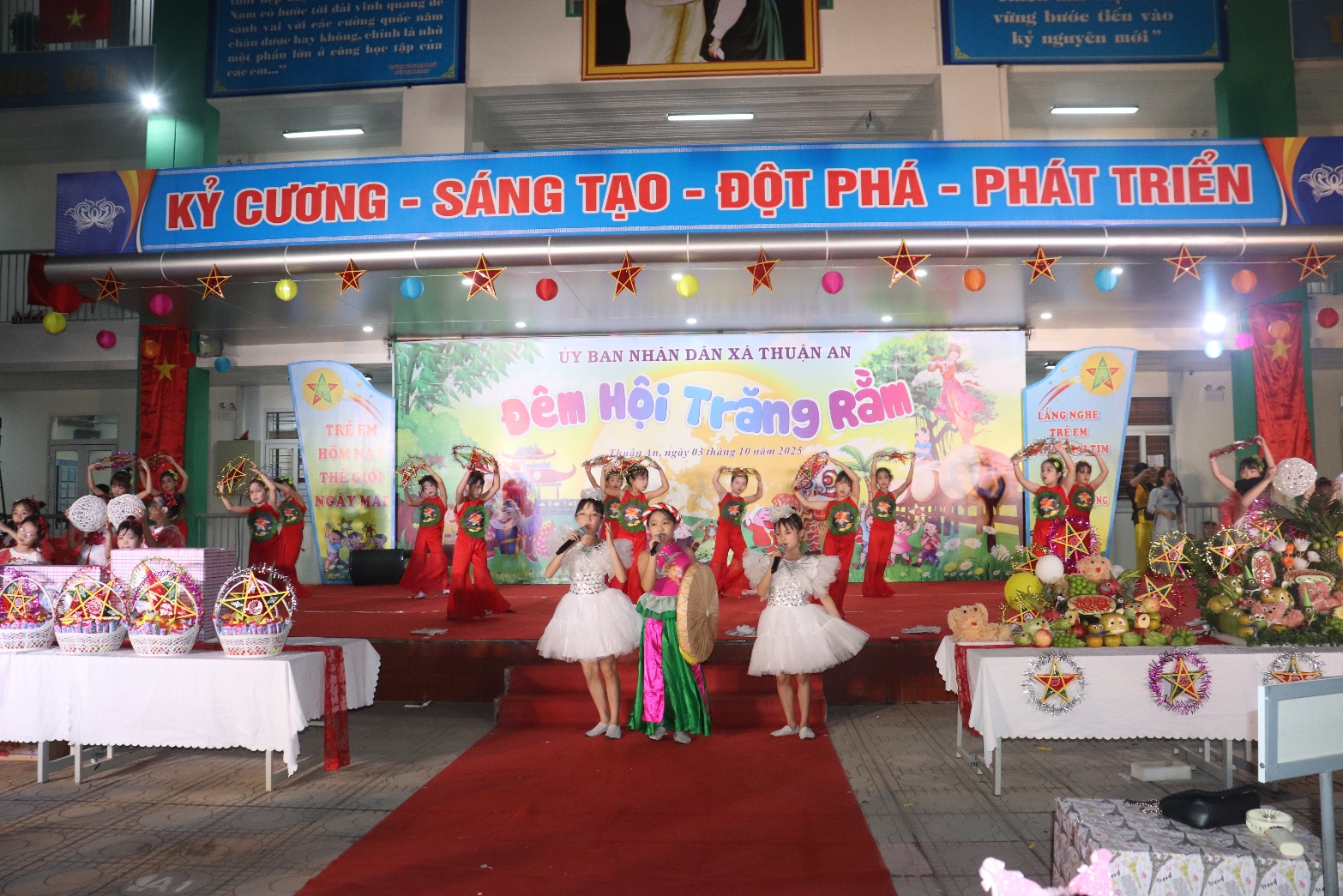 A group of girls performing on a stage  AI-generated content may be incorrect.