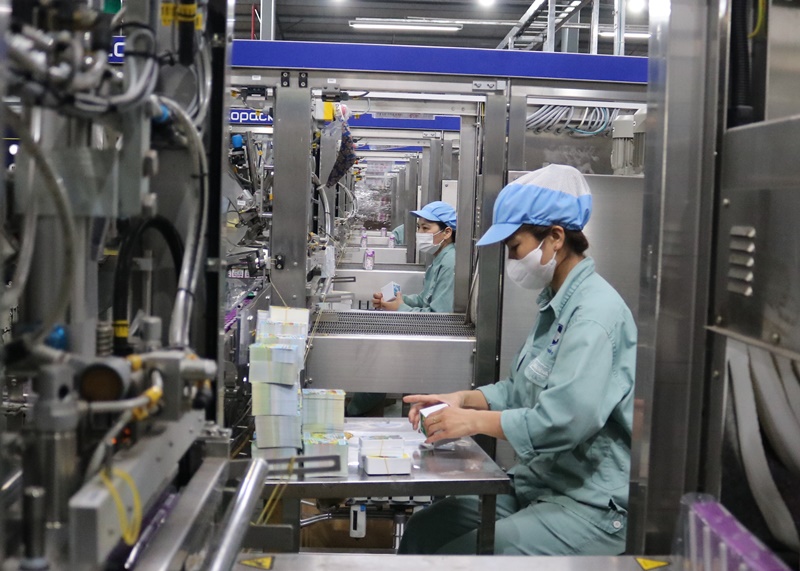 A person in a factory  AI-generated content may be incorrect.