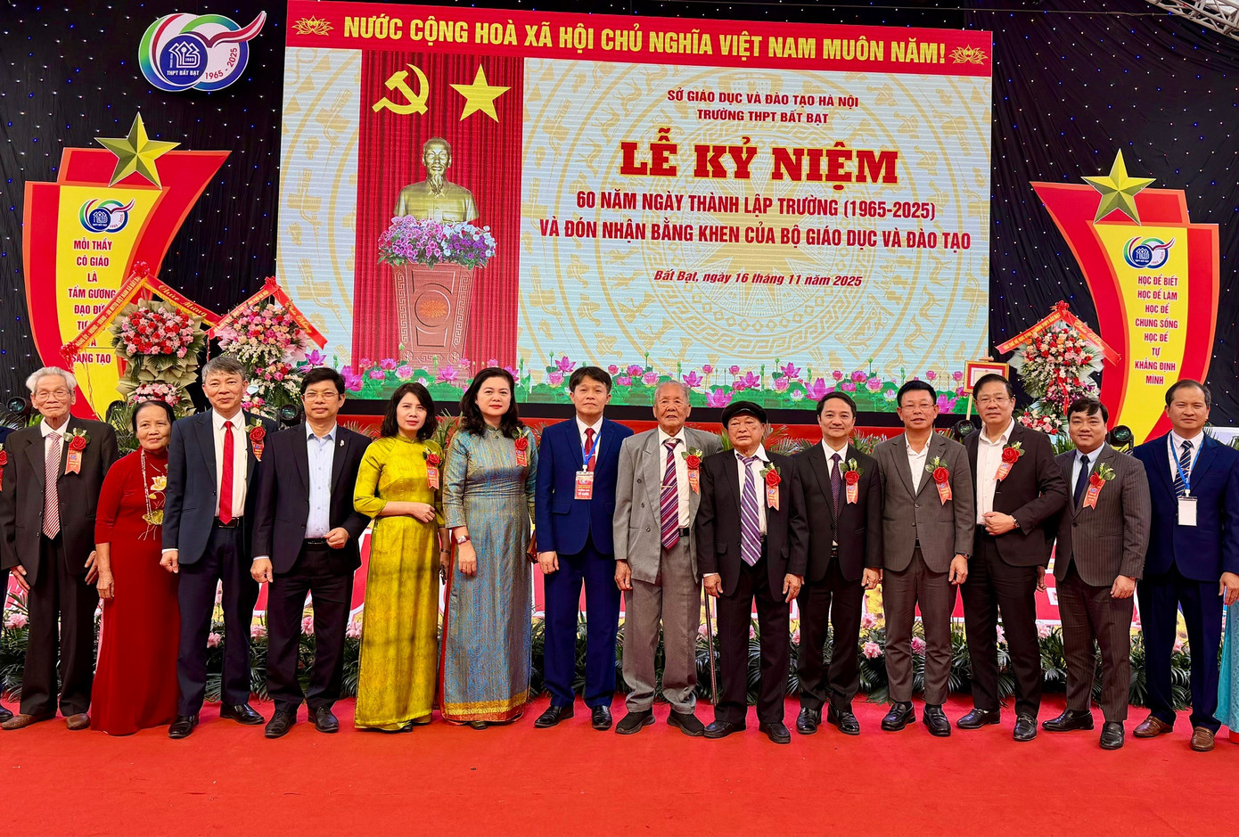 A group of people standing on a stage  Description automatically generated