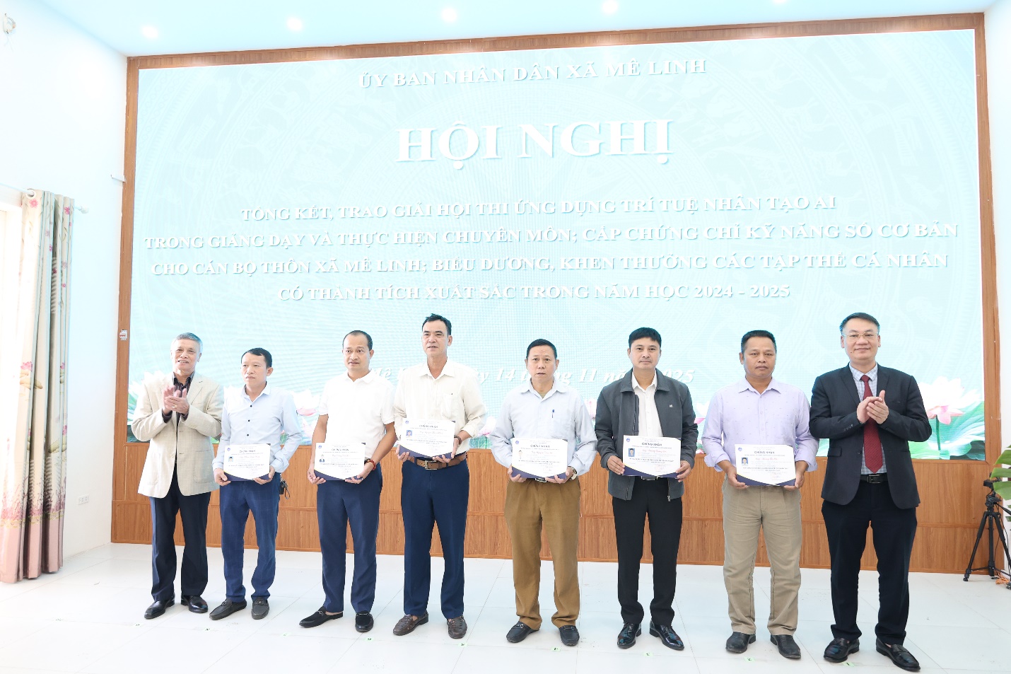 A group of men standing in front of a screen  AI-generated content may be incorrect.