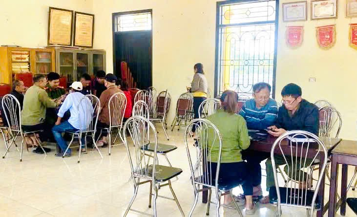 A group of people sitting at a table  Description automatically generated