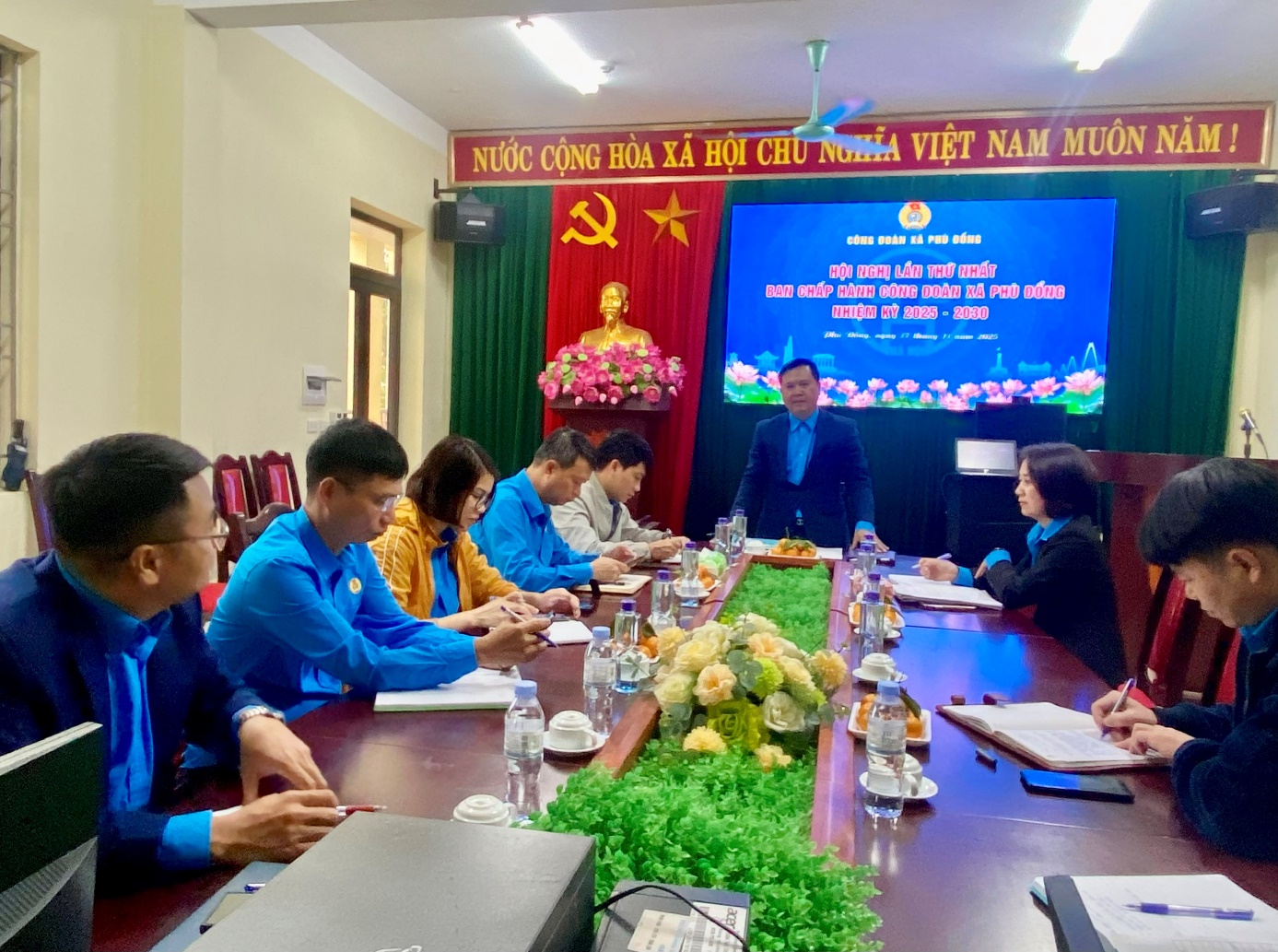 A group of people sitting around a table  AI-generated content may be incorrect.