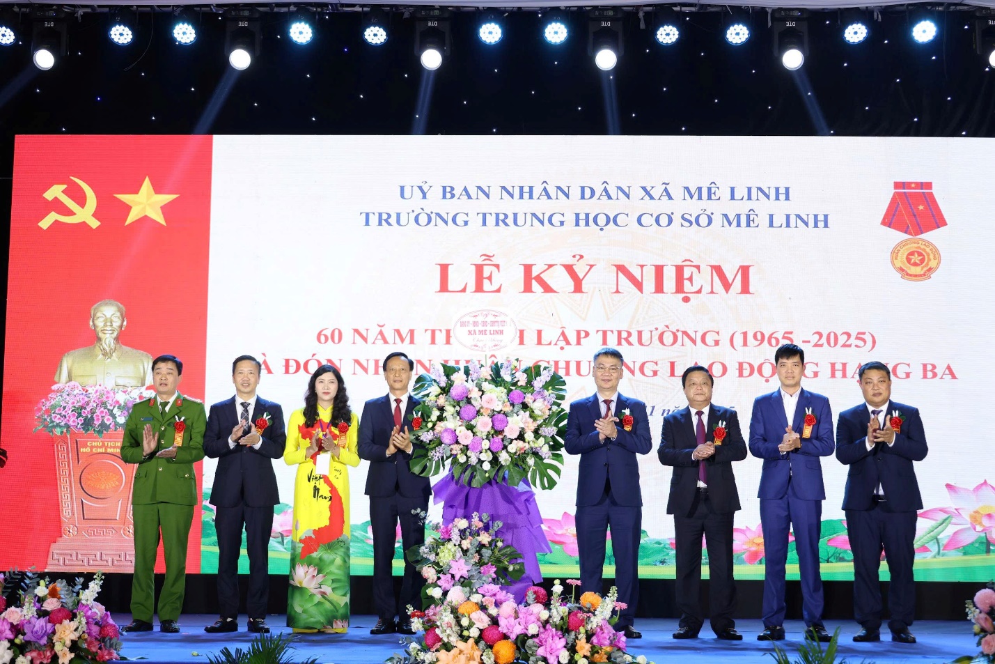 A group of people standing on a stage  AI-generated content may be incorrect.