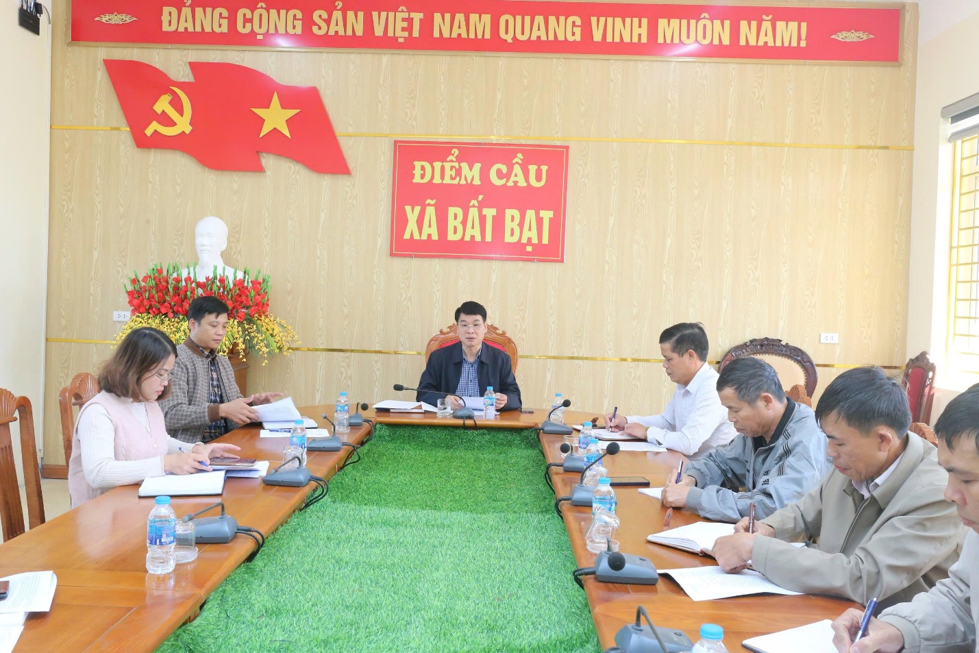 A group of people sitting at a table  Description automatically generated