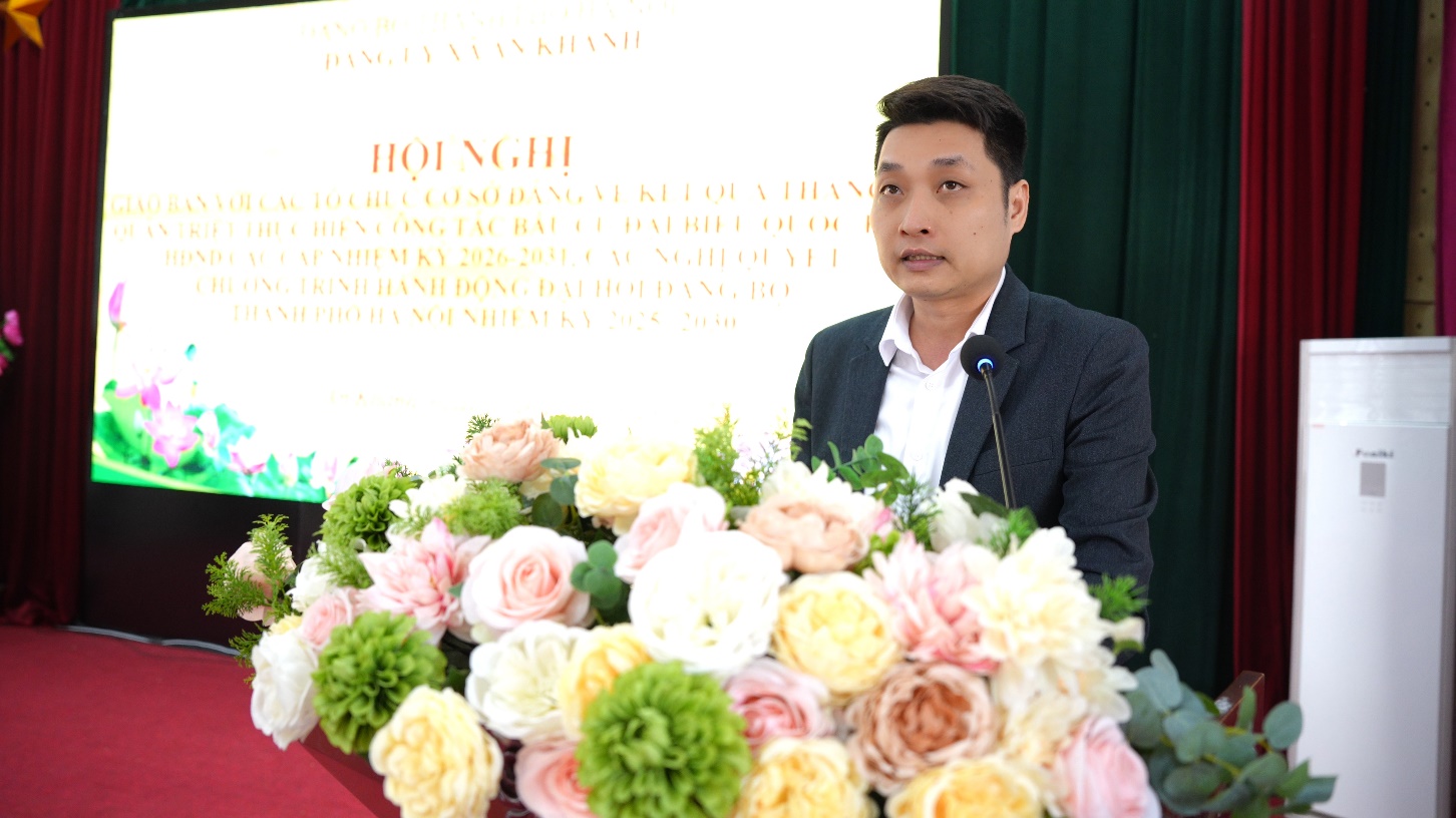 A person standing behind a table with flowers  AI-generated content may be incorrect.