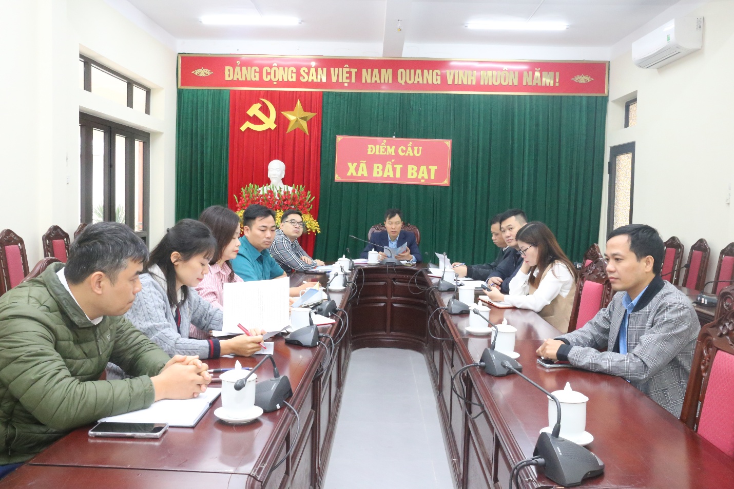 A group of people sitting at a table  Description automatically generated