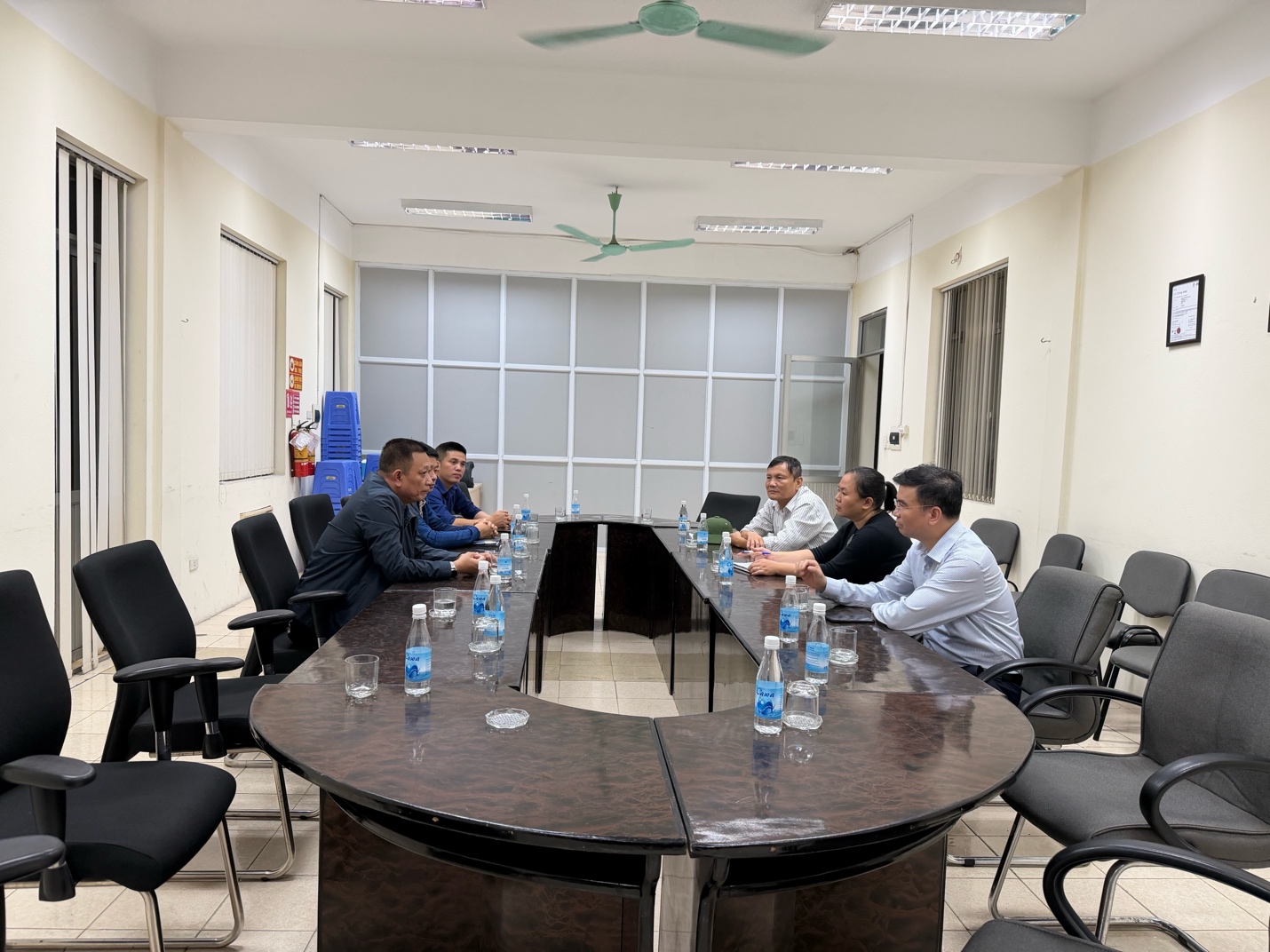 A group of people sitting around a table  AI-generated content may be incorrect.