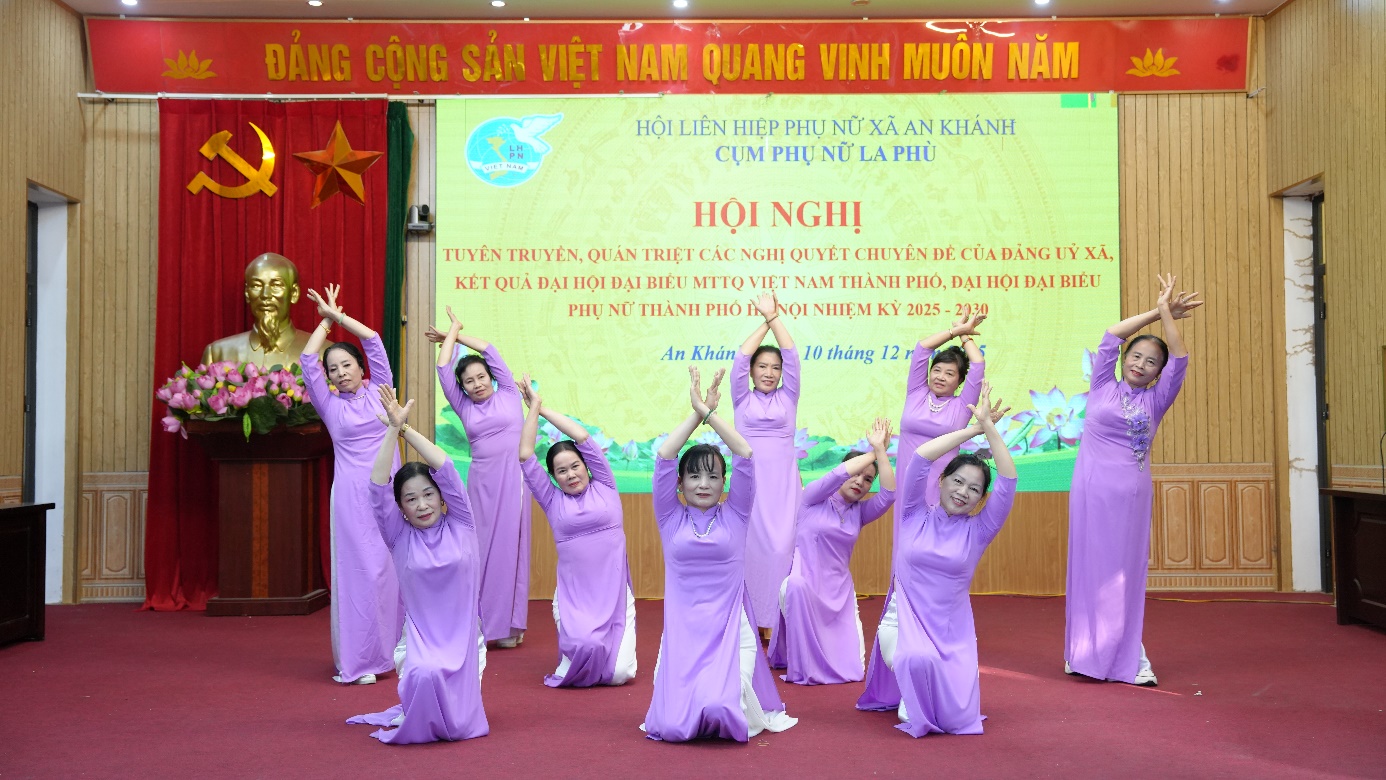 A group of women in purple dresses performing on a stage  AI-generated content may be incorrect.