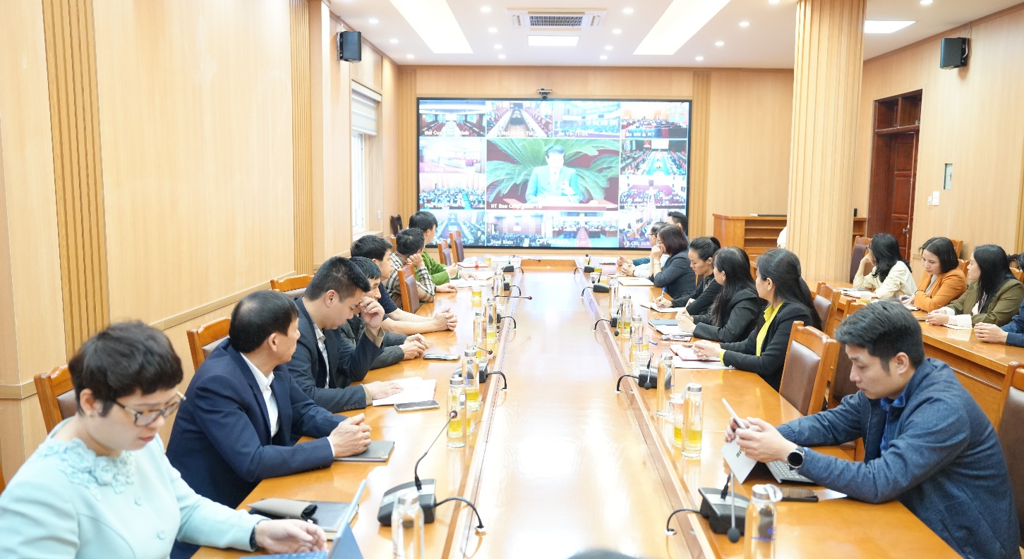 A group of people sitting at a table  AI-generated content may be incorrect.