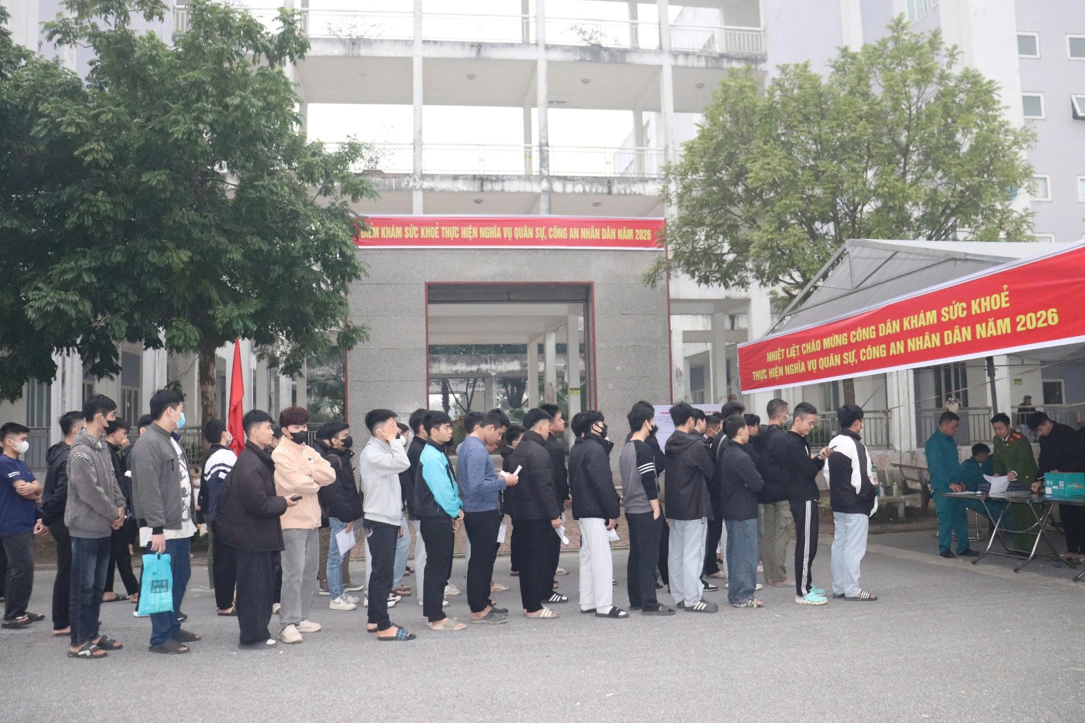 A group of people standing in a line  AI-generated content may be incorrect.