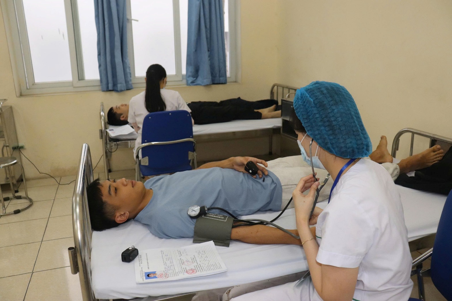 A doctor checking a patient's blood pressure  AI-generated content may be incorrect.