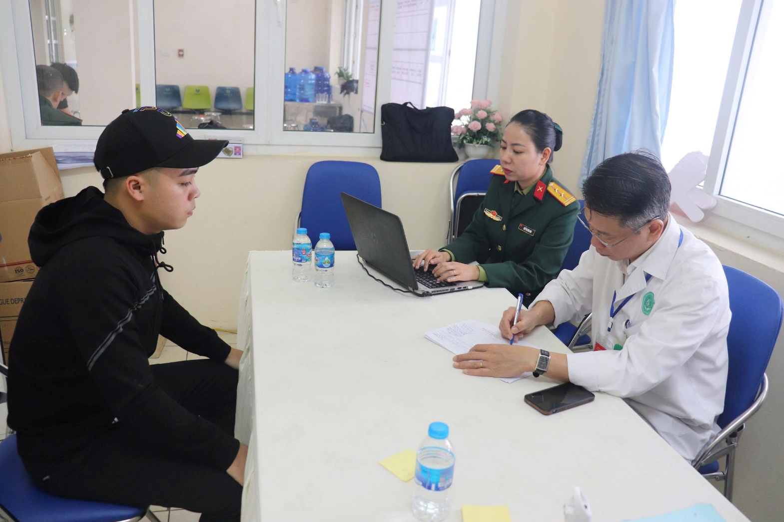 A group of people sitting at a table  AI-generated content may be incorrect.