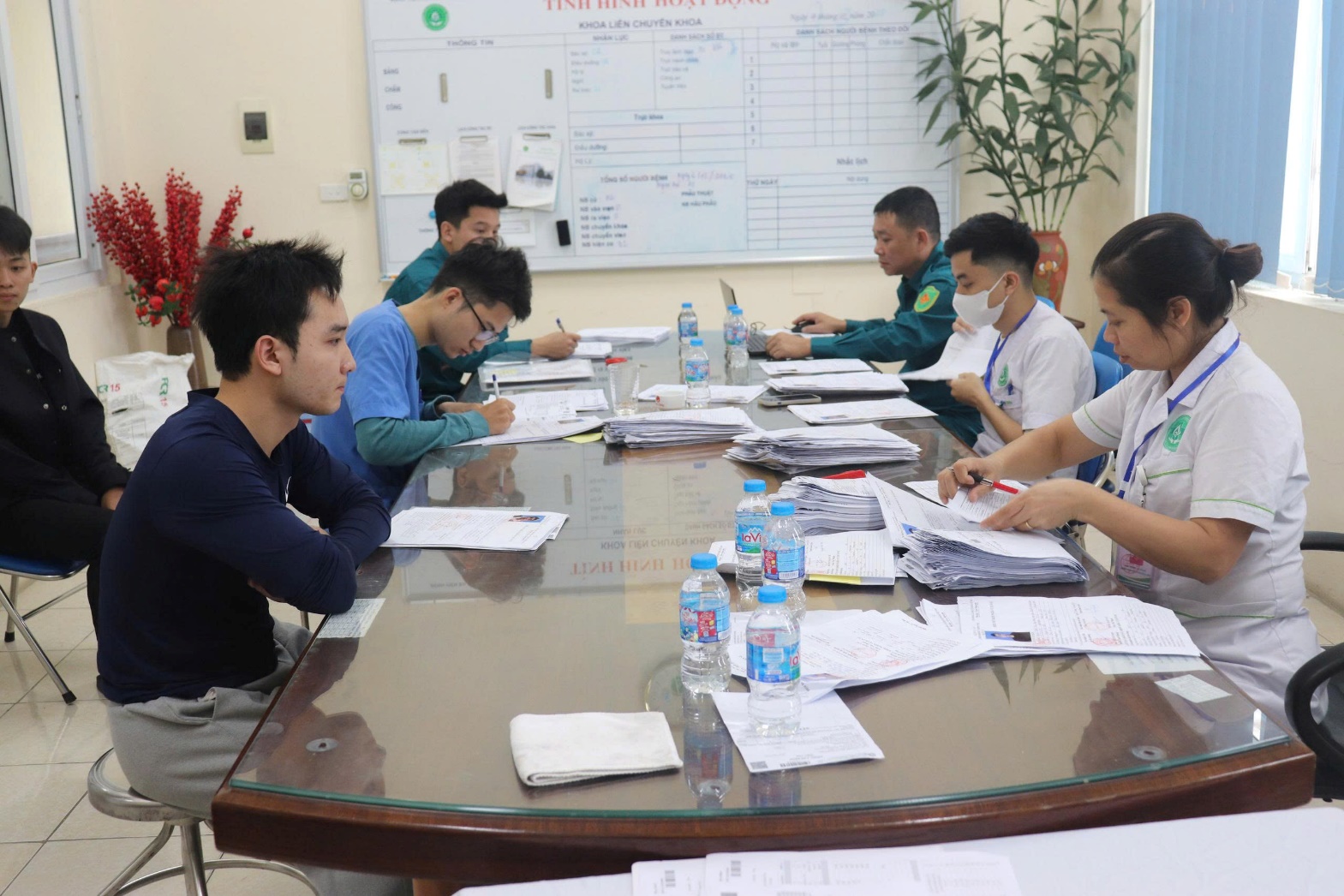 A group of people sitting around a table  AI-generated content may be incorrect.