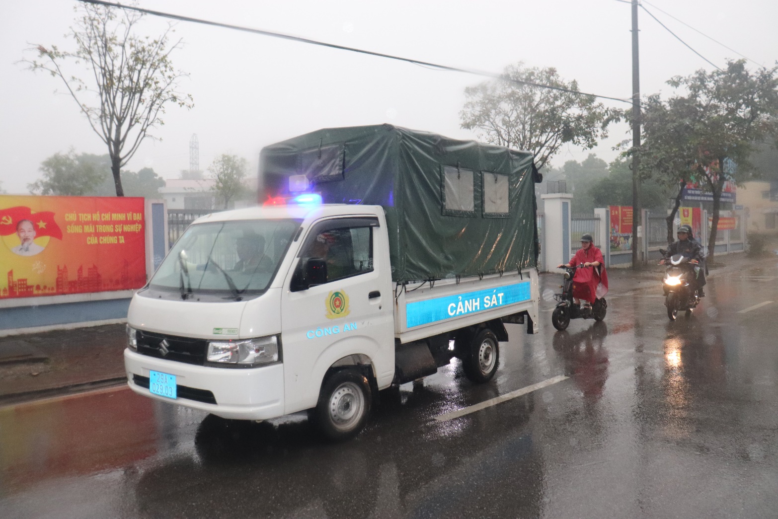 A white truck with a green tarp on top  AI-generated content may be incorrect.