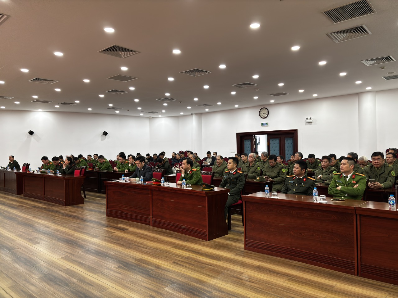 A group of people in a meeting  AI-generated content may be incorrect.