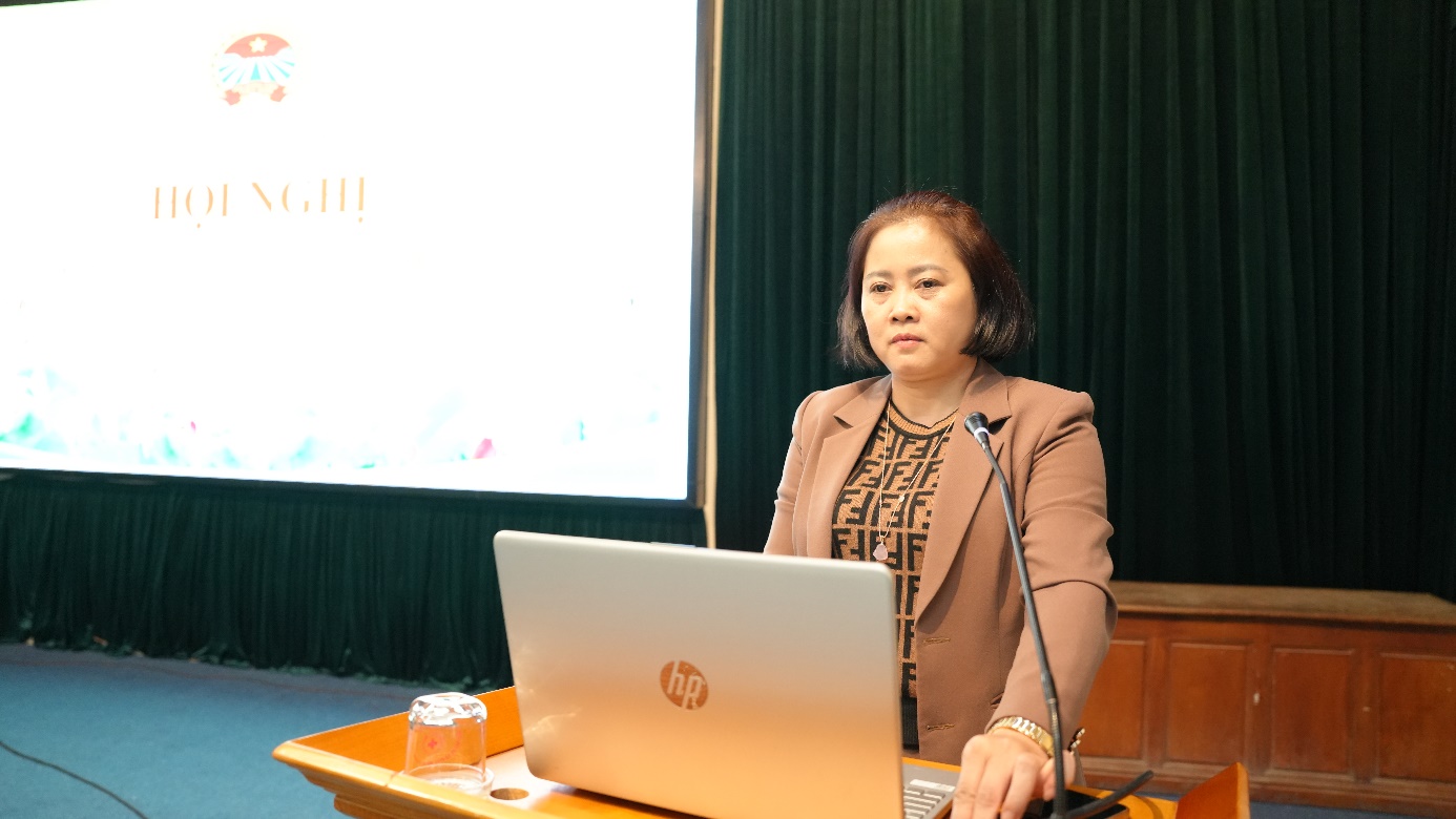 A person standing at a podium with a computer  AI-generated content may be incorrect.