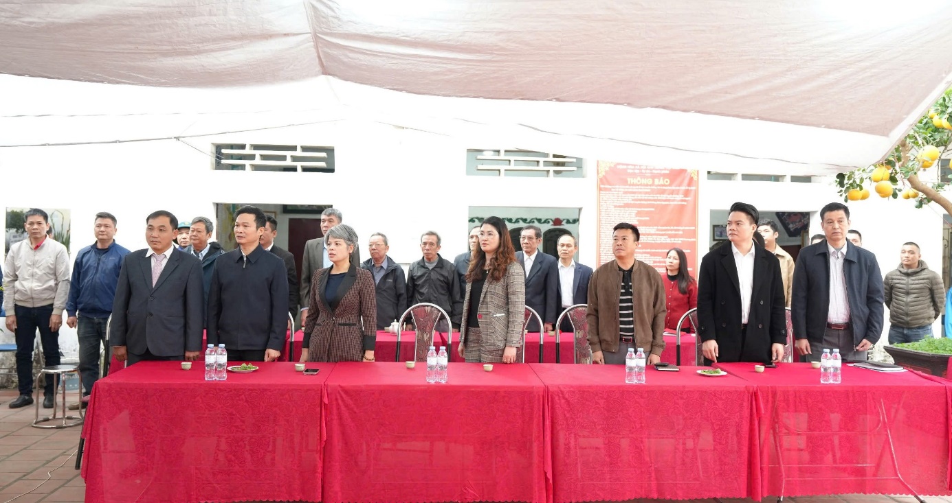 A group of people standing at a table  AI-generated content may be incorrect.