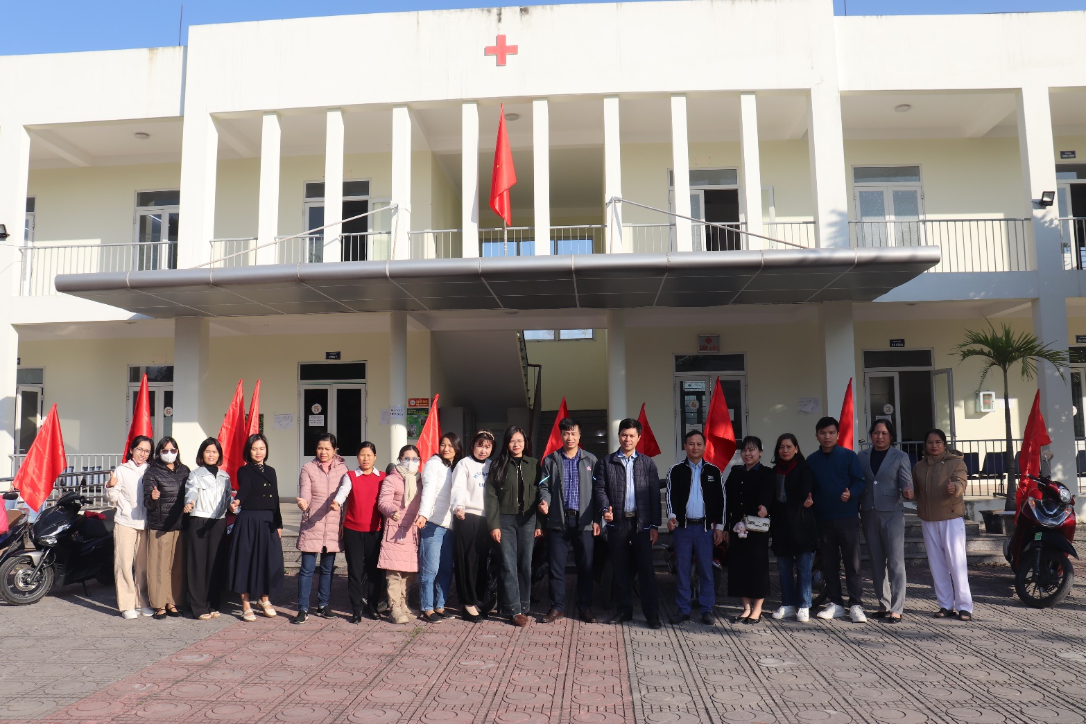 A group of people standing in front of a building  AI-generated content may be incorrect.