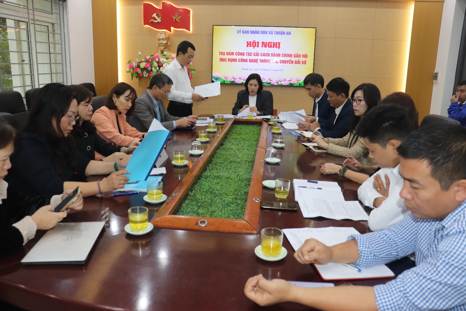 A group of people sitting around a table  AI-generated content may be incorrect.