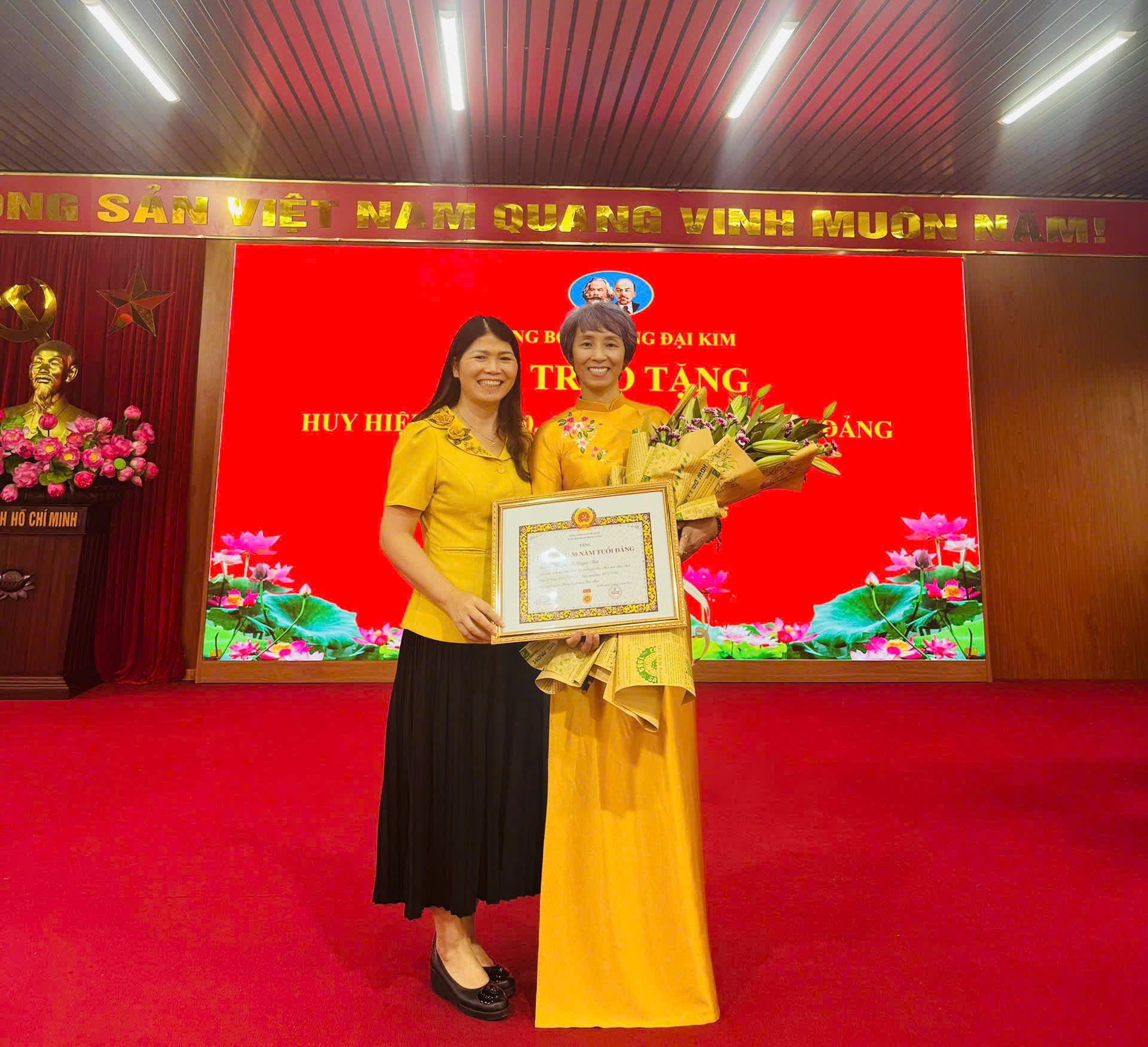 Two women holding a certificate  AI-generated content may be incorrect.