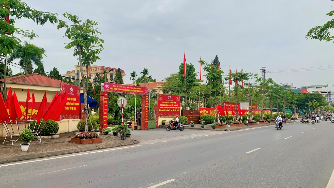 A road with red signs and flags  AI-generated content may be incorrect.