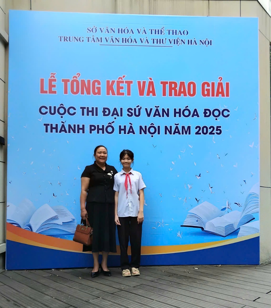 Two people standing in front of a sign  AI-generated content may be incorrect.