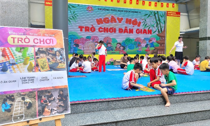 A group of children sitting on a blue mat  AI-generated content may be incorrect.