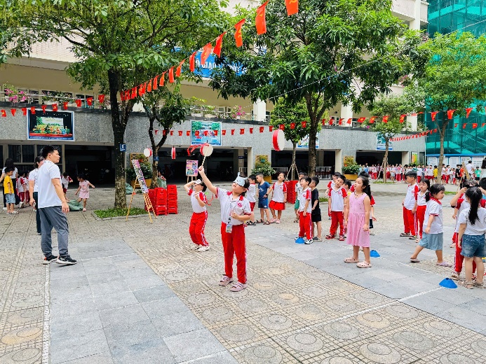 A group of children in red and white uniforms  AI-generated content may be incorrect.