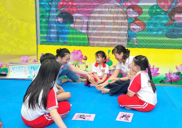 A group of people sitting on the floor  AI-generated content may be incorrect.