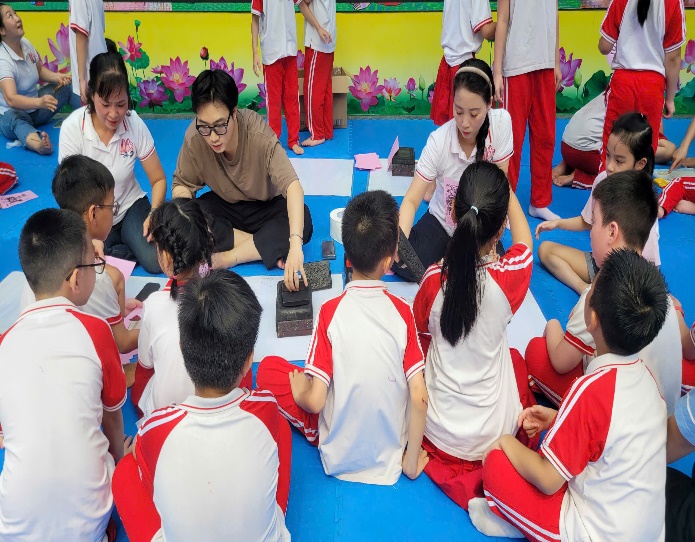 A group of children sitting on the floor  AI-generated content may be incorrect.