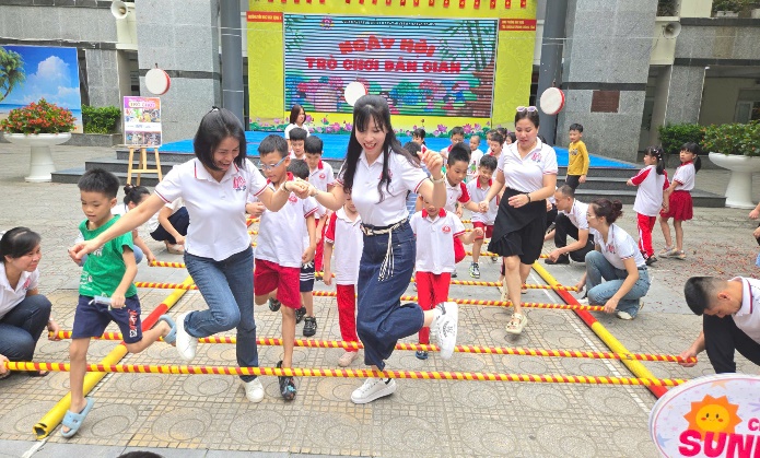 A group of people jumping on a rope  AI-generated content may be incorrect.