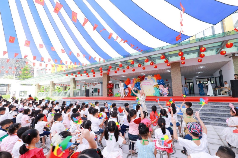 A group of children sitting in chairs in front of a large tent  AI-generated content may be incorrect.