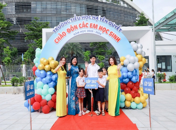 A group of people standing under a sign  Description automatically generated