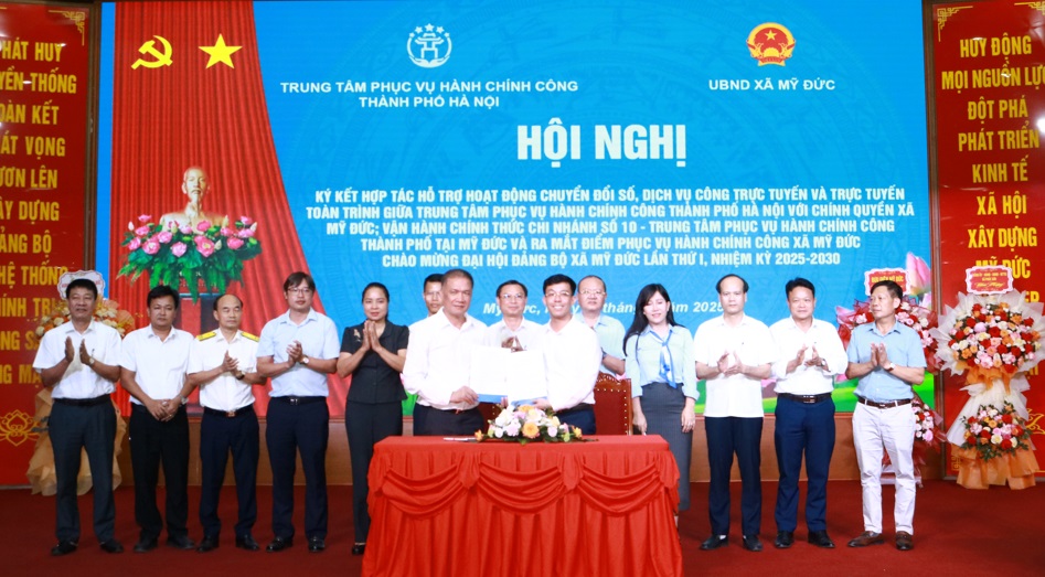 Hội nghị ký kết hợp tác, nâng cao chất lượng dịch vụ công trực tuyến, dịch vụ công toàn trình tại Mỹ Đức- Ảnh 1.