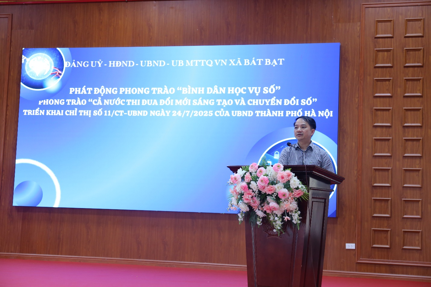 A person standing at a podium  Description automatically generated