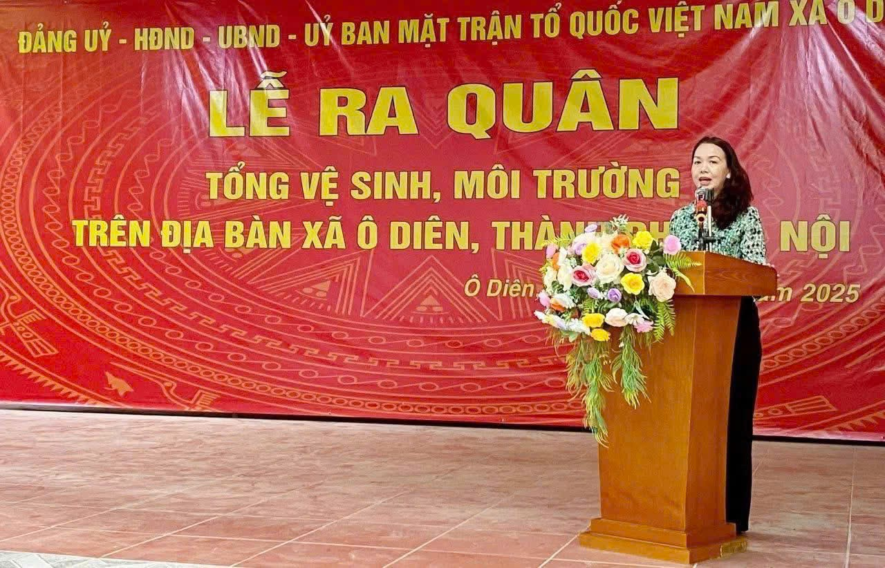 A person standing at a podium with flowers  Description automatically generated