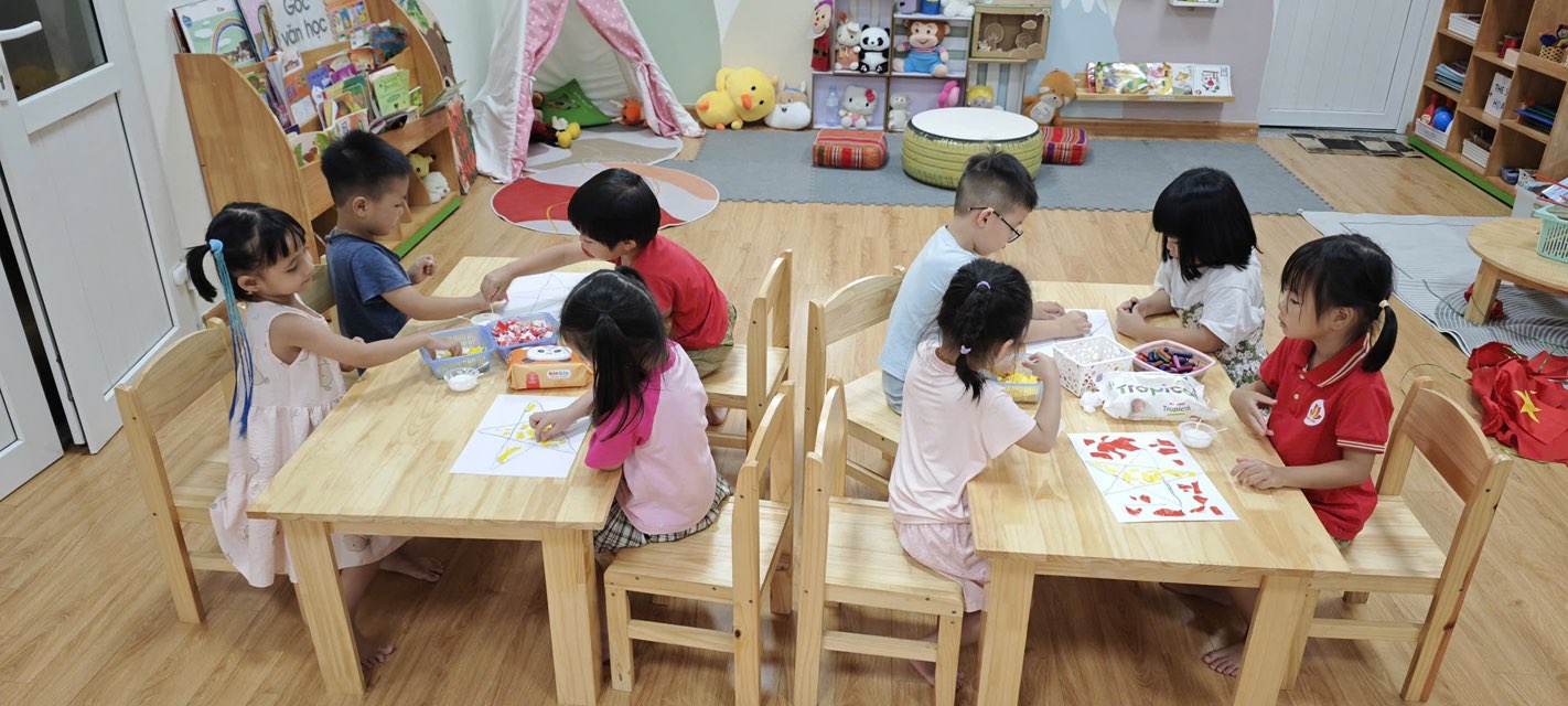 A group of children sitting at a table  AI-generated content may be incorrect.