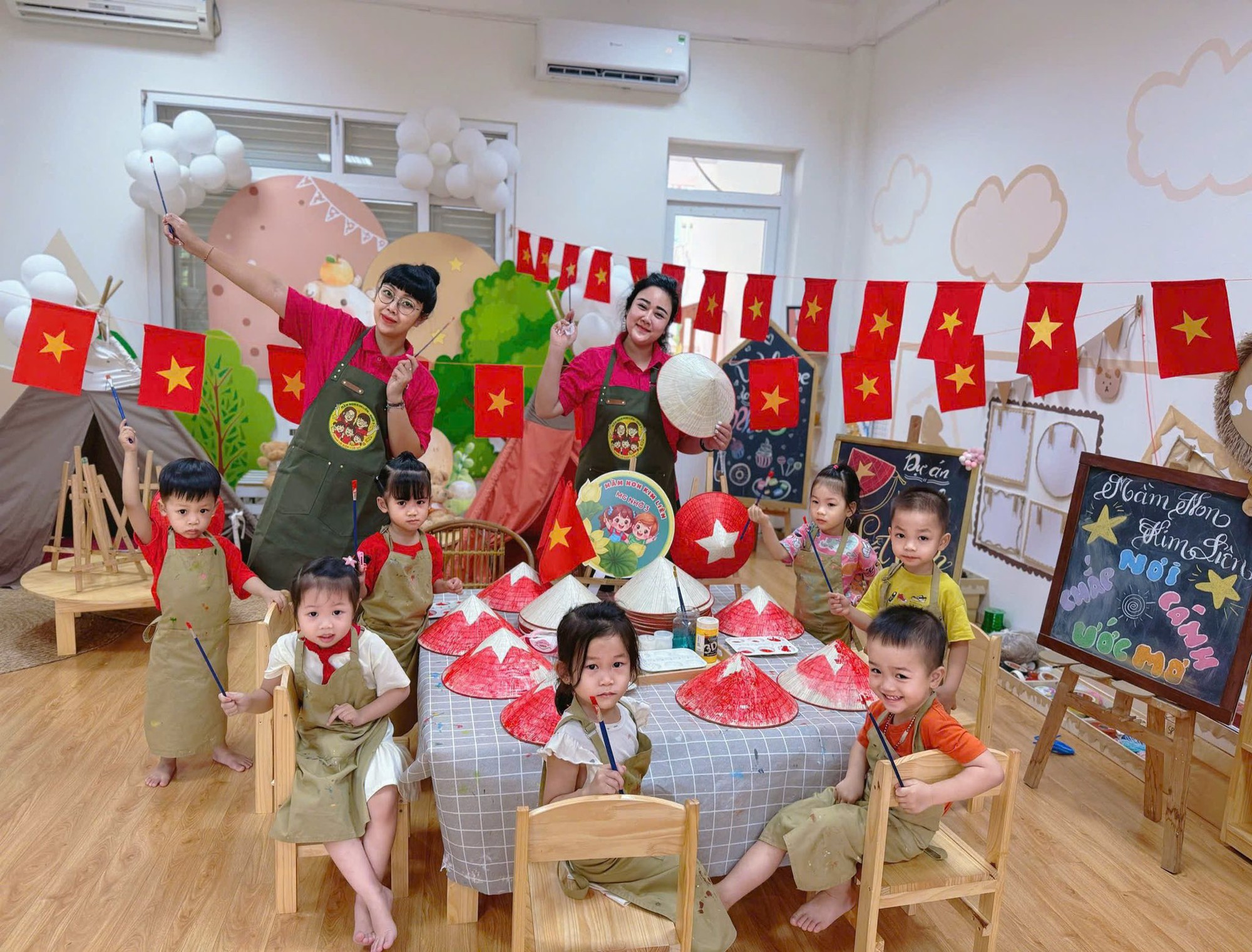 A group of children in a room with a table with flags  AI-generated content may be incorrect.